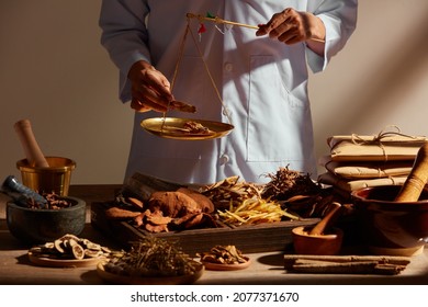 Traditional chinese medicine with herb and spices in brown wooden background and a doctor for advertising , chinese traditional medicine content  - Shutterstock ID 2077371670