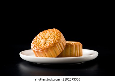 Traditional Chinese mid autumn festival mooncake isolated on black background.(the word "蛋黄" meaning egg yolk) - Shutterstock ID 2192893305