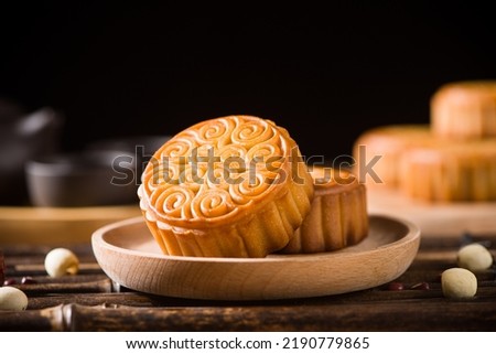 Traditional Chinese mid autumn festival mooncake on wooden table