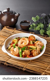 traditional chinese seafood big tiger fresh prawn vegetables with XO premium sauce in plate pot on grey vintage background asian cafe hotel luxury halal food restaurant banquet menu