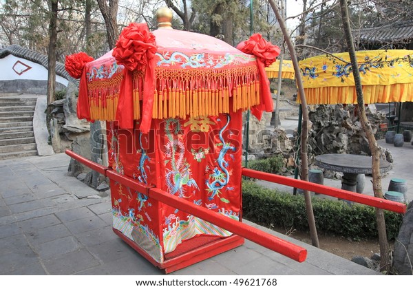 traditional Chinese wedding sedan chair for\
carrying the bride