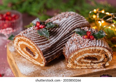 Traditional Christmas cake, chocolate Yule log with festive decorations  - Shutterstock ID 2033850266