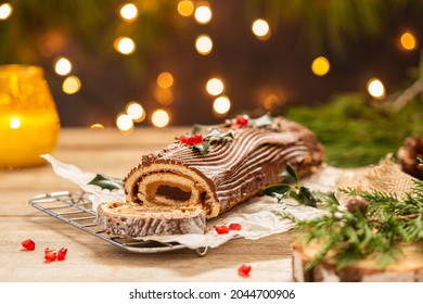 Traditional Christmas cake, chocolate Yule log with festive decorations  - Shutterstock ID 2044700906