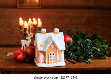 Traditional christmas ceramic house for tealight. Seasonal lantern for the table or windowsill. - Powered by Shutterstock