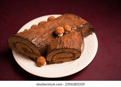 Traditional Christmas dessert, "log" decorated for the holiday - Shutterstock ID 2396383339