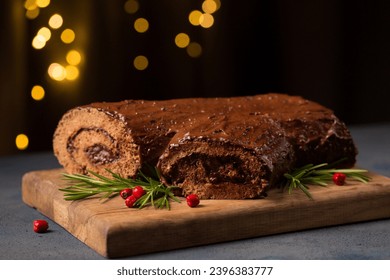 Traditional Christmas dessert, "log" decorated for the holiday - Shutterstock ID 2396383777