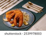 Traditional Christmas dinner in Czech Republic - fried carp with potato salad