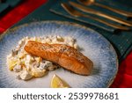 Traditional Christmas dinner in Czech Republic - salmon fillet with potato salad