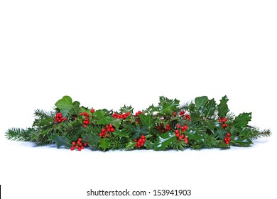 A Traditional Christmas Garland Made From Fresh Holly With Red Berries, Green Ivy Leaves And Sprigs Of Conifer Spruce. Isolated On A White Background.