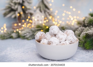 Traditional Christmas Snowball Cookies With Almonds On Snowy  Background