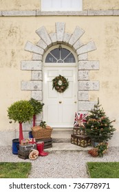 Traditional Christmas Wreath On An English Country House Door