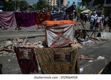 Traditional Clothes Hang On A Rope As Protesters Stand Behind The Clothesline During Against The Military Coup In Yangon, Myanmar On 4 March 2021.