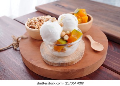 Traditional Coconut Milk Ice Cream Topped With Milk And Roasted Peanuts.