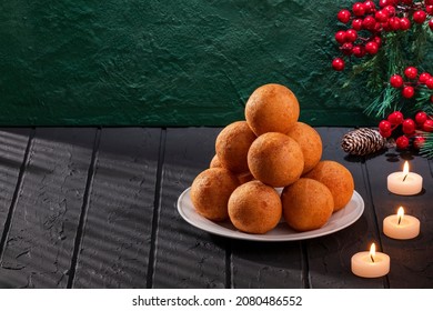 Traditional Colombian Buñuelo - Christmas Atmosphere. Candles