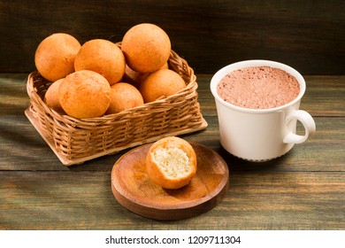 Traditional Colombian Buñuelo - Deep Fried Cheese Bread. Hot Chocolate Drink