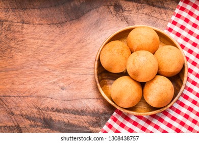 Traditional Colombian Buñuelo - Deep Fried Cheese Bread. Space Text