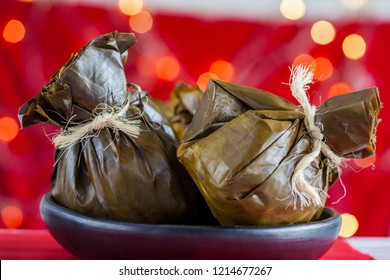 Traditional Colombian Tamale As Made On Tolima Region Over A Christmas Red Background