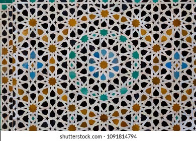 Traditional Colorful Geometrical Patern Of Mosaic On The Wall Of Islamic School Madrasa Bou Inania, Fez, Morocco.