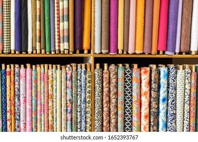 Traditional Colorful Indian Clothes Stacked In A Textile Showroom Of India. Mysore Silk