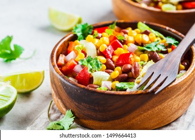 Traditional Corn Bean Mexican Salad In Wooden Bowl. Mexican Food Concept.