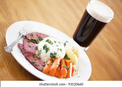 Traditional Corned Beef Dinner With Beer On A Table