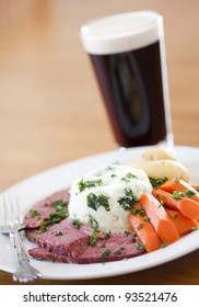 Traditional Corned Beef Dinner With Beer On A Table