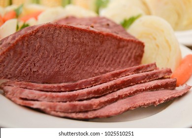 Traditional Corned Beef Dinner With Corned Beef, Cabbage, Carrots, And Sweet Corn, The Perfect Meal To Celebrate St. Patrick's Day, An Irish Tradition Celebrated Each Year In March.