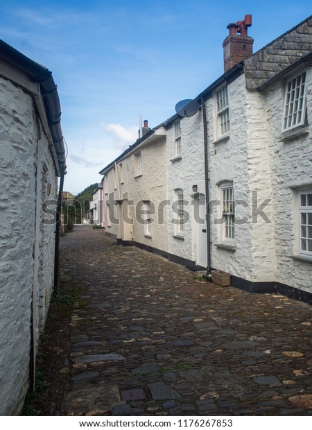Traditional Cornish Cottages Lining Cobbled Street Stock Photo