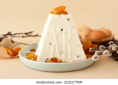 Traditional curd Easter cake with dried apricots and raisins on color background