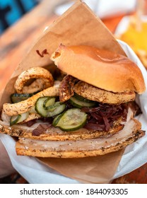 Traditional Danish Pork Sandwich With Roast Pork Rind And Crackling Crispy Skin With Red Cabbage And Pickles In A Brioche Bun Fast Food Unhealthy Greasy Food