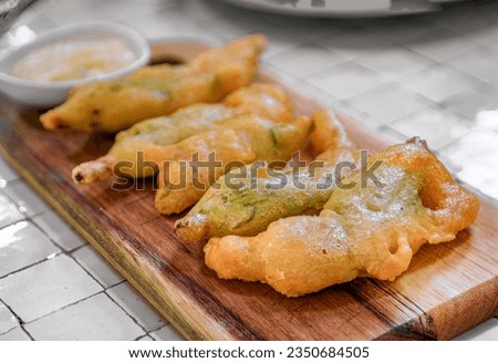 Traditional delicacy from South of France, fried courgette or zucchini flowers at a restaurant, Saint Paul de Vence, French Riviera, South of France