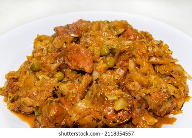 Traditional deutsch stew cabbage with meat, close up dish on the white plate - Shutterstock ID 2118354557