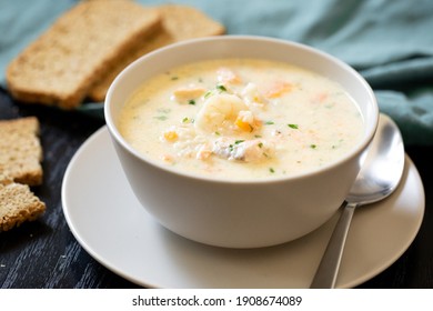 Traditional dish seafood chowder with slices of soda bread
