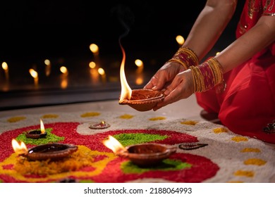 Traditional diya lamps lit during diwali celebration - Shutterstock ID 2188064993