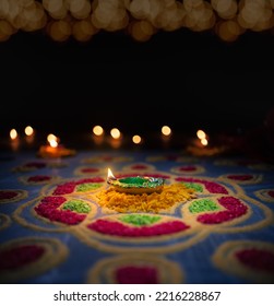 Traditional diya lamps lit during diwali or deepavali celebration