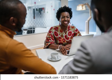 Traditional Dressed Black African Business Woman Financial Bank Adviser In Meeting With Customer. African Pattern