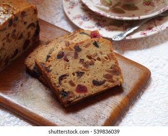 Traditional dried fruit cake for Christmas on wooden plate.  - Powered by Shutterstock