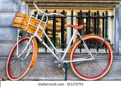 Traditional dutch bicycle parked at the front in Amsterdam, The Netherlands