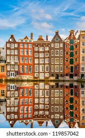Traditional dutch buildings on canal in Amsterdam
