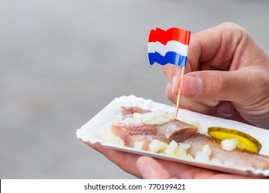 Traditional Dutch Food: Herring Fish With Onion In Fastfood Market Of Amsterdam, Netherlands