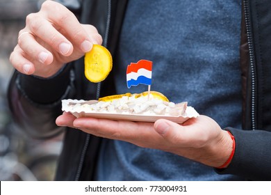 Traditional Dutch Food: Herring Fish With Onion In Fastfood Market Of Amsterdam, Netherlands