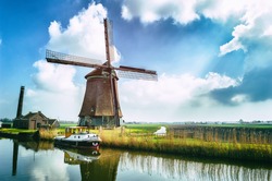 Traditional Dutch Windmill Near The Canal. Netherlands