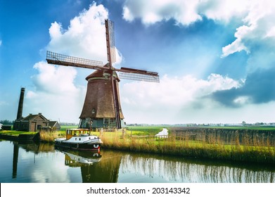Traditional dutch windmill near the canal. Netherlands