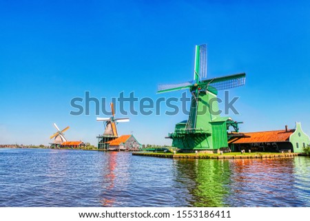 traditional dutch windmills of the Netherlands one of the main tourists attractions in Holland, shot in Zaanse Schans