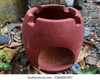 traditional earth stove burning stove - Shutterstock ID 2368681407