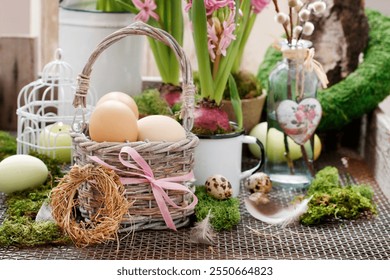 Traditional Easter decoration with hyacinth flowers, hay wreath, painted eggs and moss. - Powered by Shutterstock