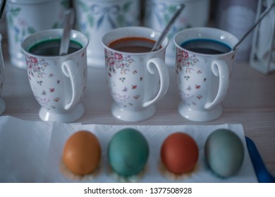 traditional easter egg painting process shot using a shallow depth of field to achieve a 3d effect and bokeh
