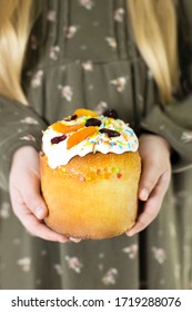 Traditional Easter Hot Cross Buns. Little Girl Holding Round Bread. Hands Holding Big Bread. Little Girl Holding Easter Cross Buns. Hands Holding Easter Cross Buns.