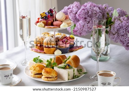 Traditional english afternoon tea with selection of cakes and sandwiches