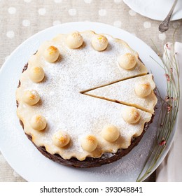 Traditional English Easter Cake With Marzipan Decoration On A White Plate. Top View.
